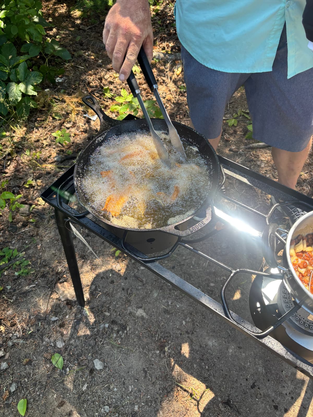 Preparing a freshly caught fish during a Reel Therapy fishing trip